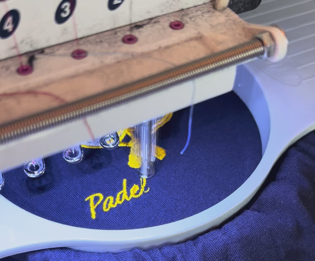 Load video: Padel wear being embroidered